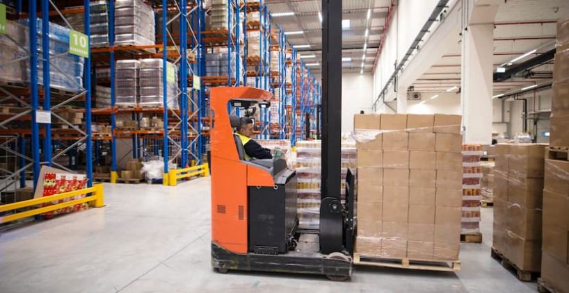 industrial-worker-protective-uniform-operating-forklift-big-warehouse-distribution-center