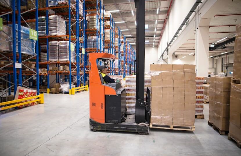 industrial-worker-protective-uniform-operating-forklift-big-warehouse-distribution-center